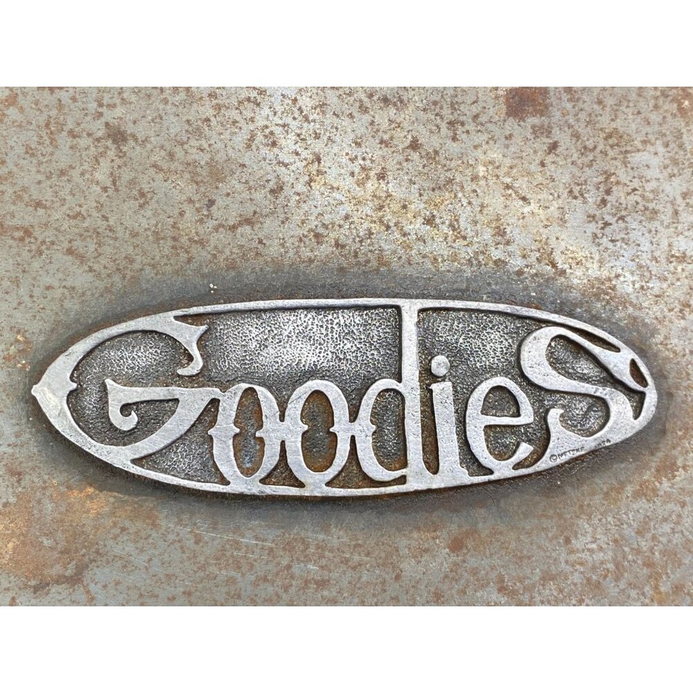 Vintage Goodies Embossed Metal Emblem Button Knick Knacks Tin Empty 8" x 3.25"